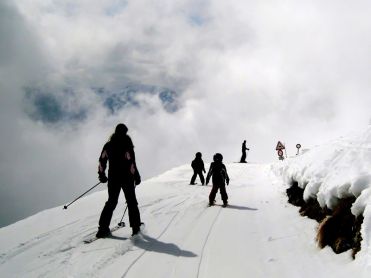 Skiers on a path